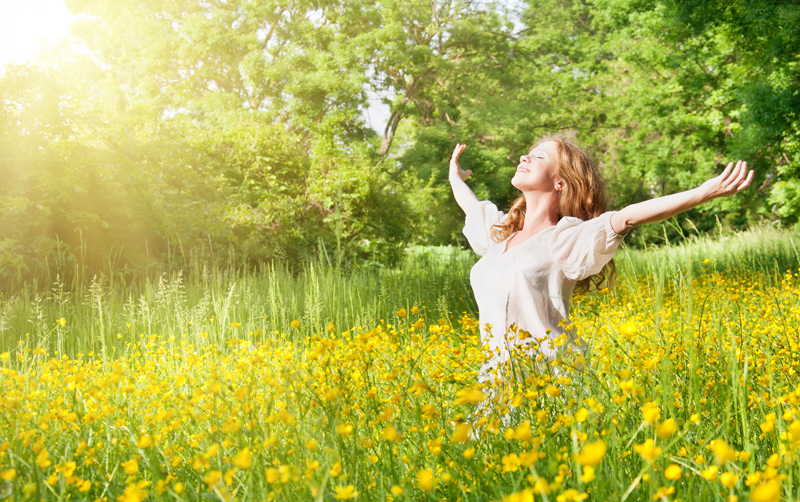 Field of flowers and a woman